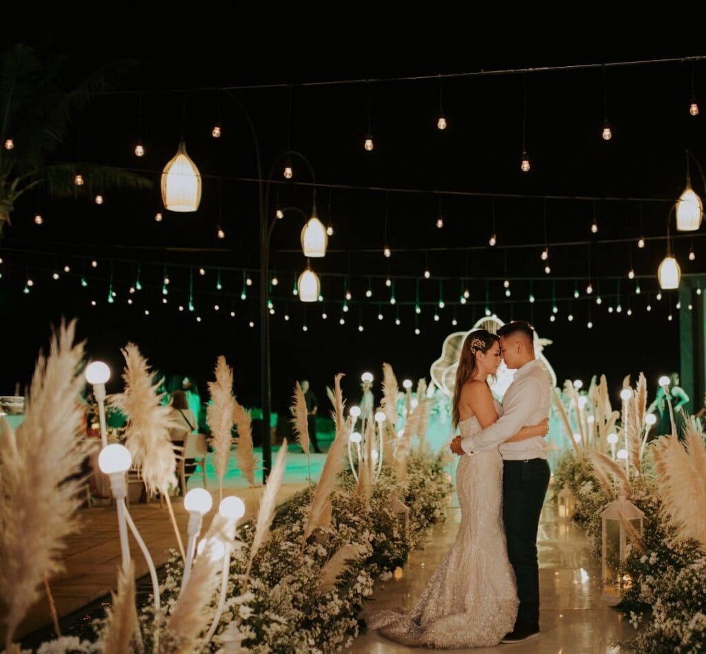 Bride and groom surrounded by meaningful wedding decor