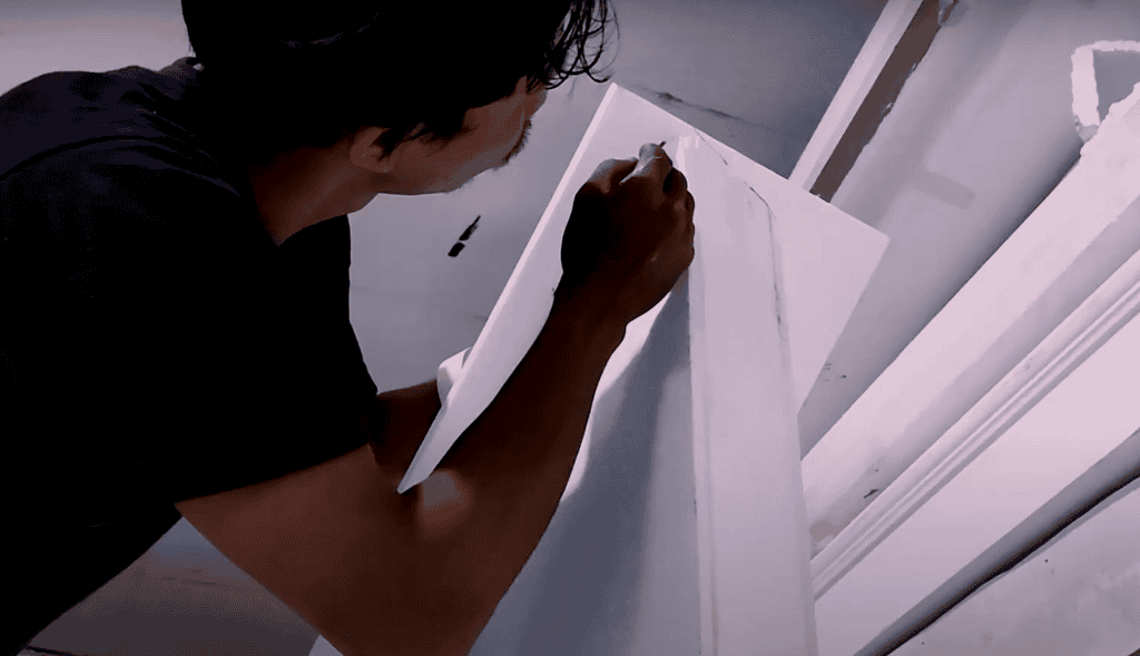 Cutting styrofoam by hand for curved stage design