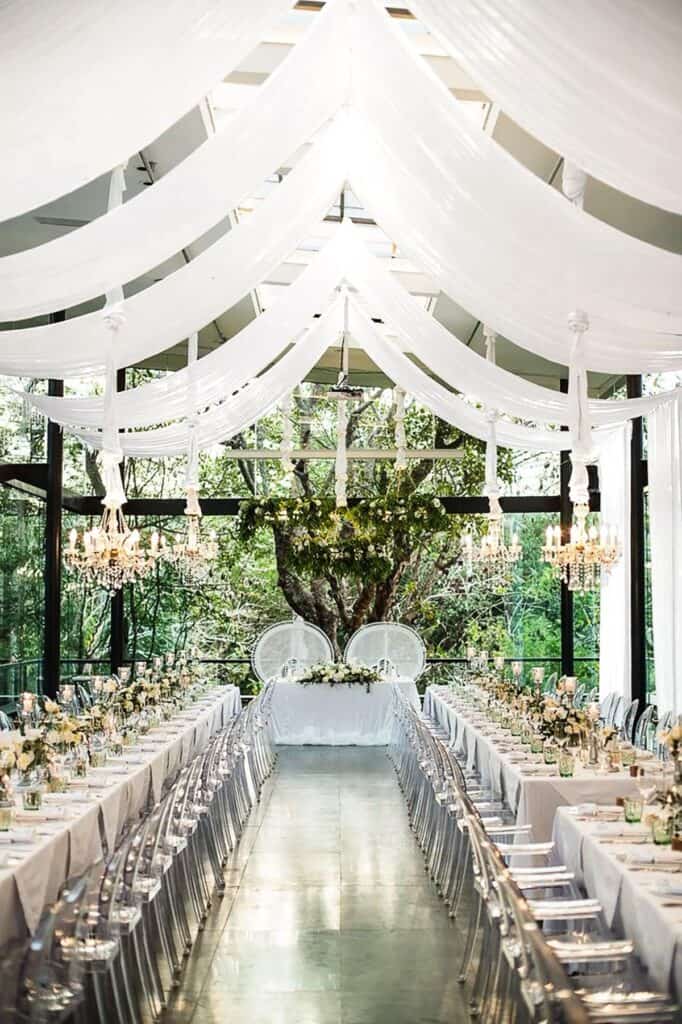 Ceiling drapery adds height and softness to venue