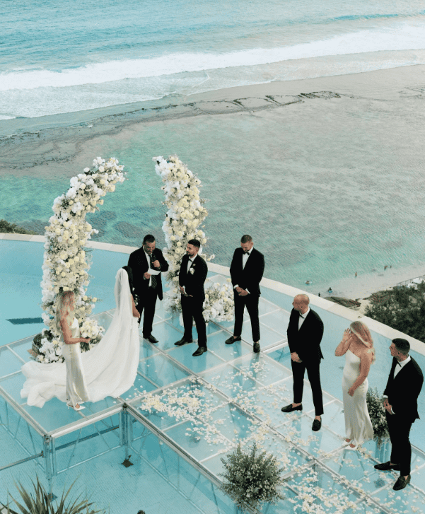 Iyia Liu and Jordan Delmont’s wedding on a glass aisle with ocean views in Bali