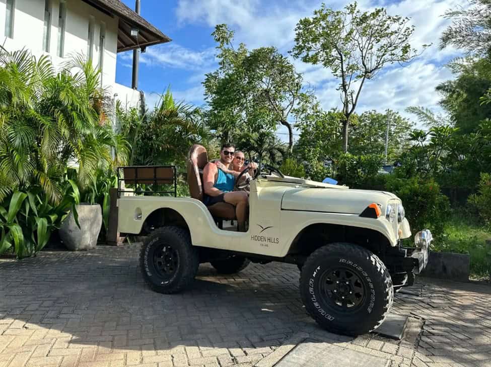 Mary Fitzgerald and Romain Bonnet riding a jeep during their honeymoon in Bali